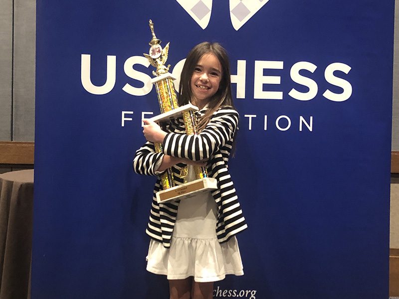 Lee-Ann with her first chess trophy, April 2019